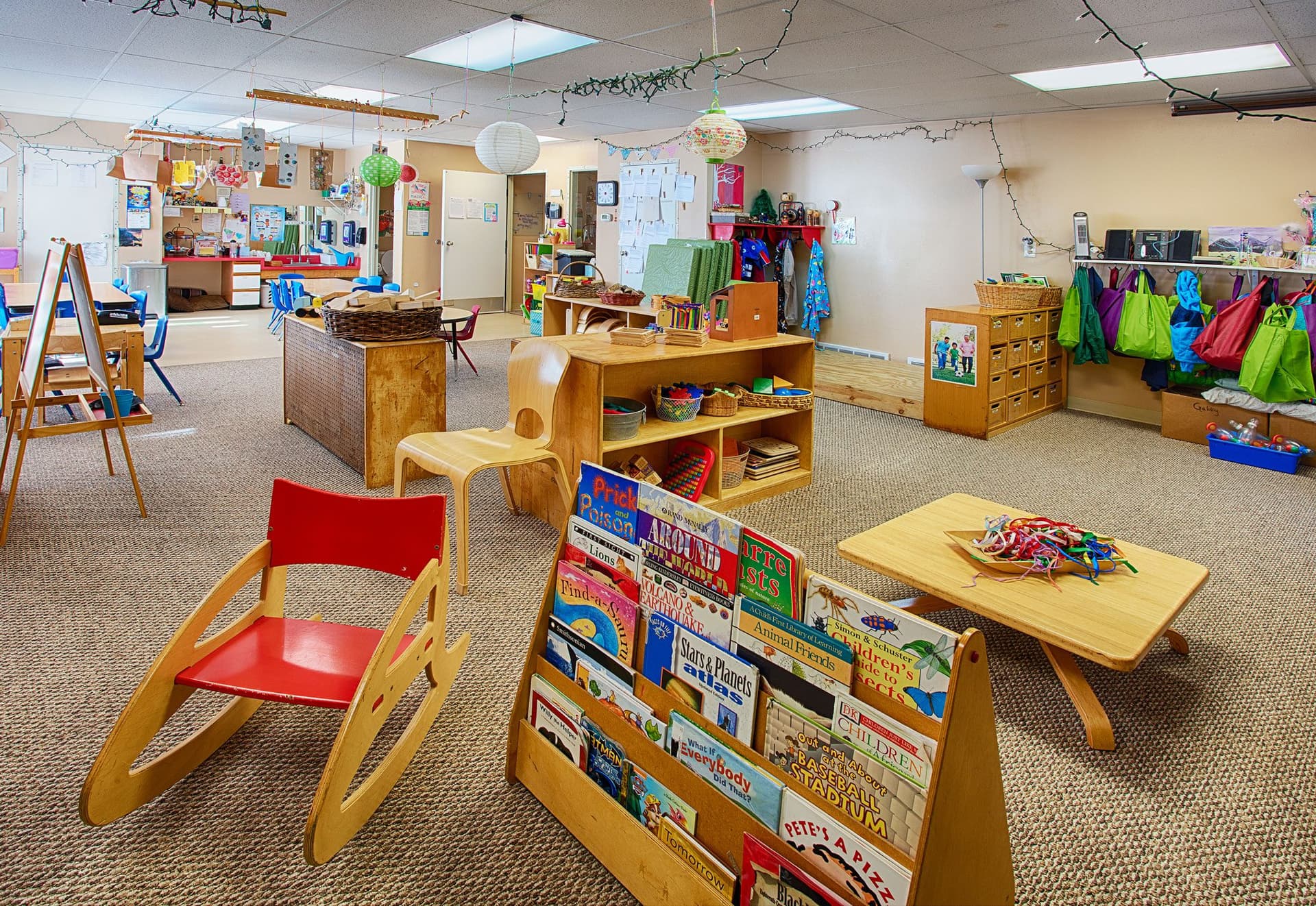 A teacher reading with children at Blue Skies Exploration Academy